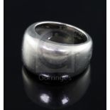 A modern Cartier large 18ct white gold band, signed and numbered G82153, size N/O, 13.9 grams.