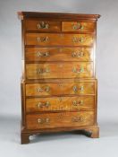 A George III mahogany chest on chest, with dentil cornice, two short and three graduated long