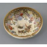 A Japanese Satsuma pottery bowl, Meiji period, the interior painted with a procession of figures