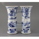 A pair of Chinese blue and white beaker vases, Gu, Kangxi period, each painted to the upper register