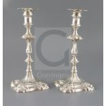 A pair of early George III cast silver candlesticks by Ebenezer Coker, with waisted knopped stems