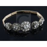 An antique gold and graduated quintuple diamond cluster set bracelet (a.f.), set with rose and rough