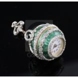 An early 20th century continental silver gilt, green enamel and diamond set ball timepiece