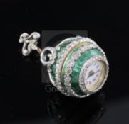 An early 20th century continental silver gilt, green enamel and diamond set ball timepiece