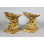 A pair of Venetian and painted giltwood grotto stools, with scallop and acanthus seats on dolphin