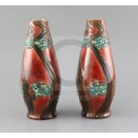 A pair of Mintons secessionist pottery vases, c.1918, each of tapering form decorated with