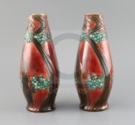 A pair of Mintons secessionist pottery vases, c.1918, each of tapering form decorated with