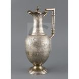 A Victorian engraved silver baluster hot water/claret jug, by Atkin Brothers, decorated in the