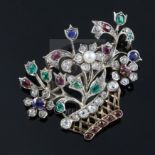 An early 20th century gold and multi gem set guiardinetto (flowers in a basket) brooch, set with