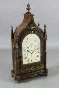 A large Regency brass inset mahogany repeating chiming bracket clock, with swept arched case,