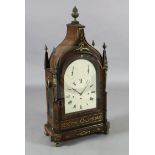 A large Regency brass inset mahogany repeating chiming bracket clock, with swept arched case,