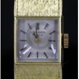 A lady's 18ct gold Longines manual wind wrist watch, with square dial and baton numerals, on