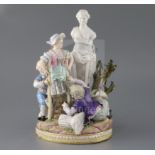 A Meissen group of children picking apples in a garden with a classical statue, late 19th century,