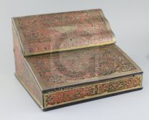 An early 20th century French red boulle work lap desk, the hinged lids enclosing a fitted interior