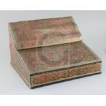 An early 20th century French red boulle work lap desk, the hinged lids enclosing a fitted interior