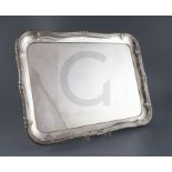 A 20th century German 800 standard white metal shaped rectangular tea tray, with decorated border,