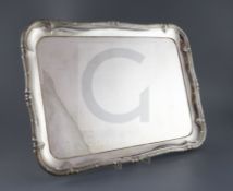 A 20th century German 800 standard white metal shaped rectangular tea tray, with decorated border,