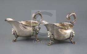 A pair of George V 18th century style silver sauceboats by Thomas of New Bond Street, with flying