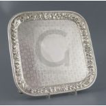 A late 19th century Tiffany & Co silver square salver, engraved with geometric flowerhead