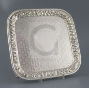 A late 19th century Tiffany & Co silver square salver, engraved with geometric flowerhead