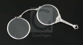 A 1920's style platinum? and diamond set lorgnette, with engraved borders and diamond encrusted