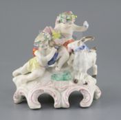 A Vauxhall porcelain group of two Bacchanalian cherubs and a goat, c.1760-5, on a scrollwork base,