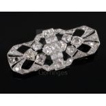A 1930's/1940's pierced platinum? and diamond set brooch, of shaped rectangular form, set with old