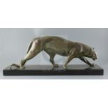 Irene Rochard. A French Art Deco bronze model of a prowling panther, on black marble plinth, width