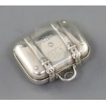 A Victorian silver vinaigrette modelled as a travelling suitcase, inscribed 'Katie 1877', the grille