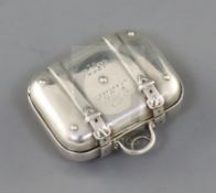 A Victorian silver vinaigrette modelled as a travelling suitcase, inscribed 'Katie 1877', the grille