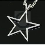 A modern Theo Fennell 18ct white gold and diamond set openwork star pendant, on an 18ct white gold