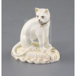 A rare Rockingham porcelain figure of a seated cat, c.1830, gilt 'CL1', incised star mark, H. 6.