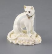 A rare Rockingham porcelain figure of a seated cat, c.1830, gilt 'CL1', incised star mark, H. 6.