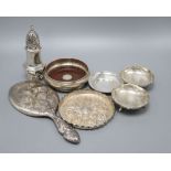 A pair of Indian white metal bon-bon dishes, a modern wine coaster, a Victorian embossed circular