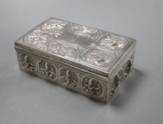 An Indian white metal cigarette box embossed with deities,15.5cm