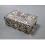 An Indian white metal cigarette box embossed with deities,15.5cm