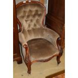 A Victorian mahogany button back armchair