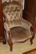 A Victorian mahogany button back armchair