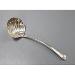 A George III base marked silver sauce ladle with scallop shell bowl, marks rubbed