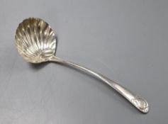 A George III base marked silver sauce ladle with scallop shell bowl, marks rubbed