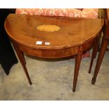 A George III mahogany and tulipwood banded 'D' shaped folding card table, with husk and paterae