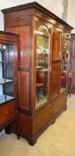 An Edwardian inlaid mahogany two door wardrobe, W.163cm, H.209cm