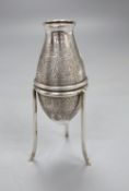 A Middle Eastern white metal vase on stand with engraved decoration, H.13cm