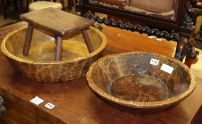 Two 19th century turned wood bowls, largest 47cm and a primitive stool, W.28cm