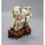 Two Chinese wooden stands (boys), height 9cm