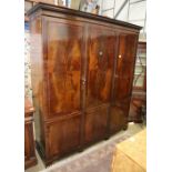 An Edwardian mahogany and boxwood line inlaid two door compactum wardrobe, W.194cm, D.61cm, H.215cm