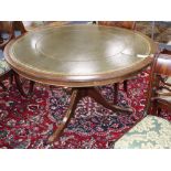 A reproduction George III style circular mahogany leather topped library table, 120cm diameter, H.