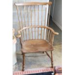 A 19th century elm and ash comb back chair, W.74cm, H.110cm