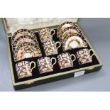 A Royal Crown Derby coffee set, cased