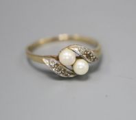 A 9ct gold seed pearl and diamond chip dress ring, size N